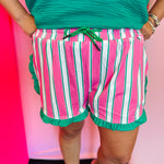 Pink and white striped shorts with green trim and ruffle detail elastic waistband
