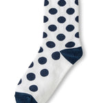 White polka dot socks with navy heel and toe accents