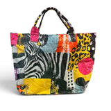 Colorful mixed-print tote bag with zebra, leopard, and polka dot designs.