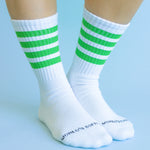 Green striped athletic-style crew socks with soft cotton blend and comfortable stretch fit