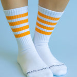 Orange striped athletic-style crew socks with soft cotton blend and cozy stretch fit