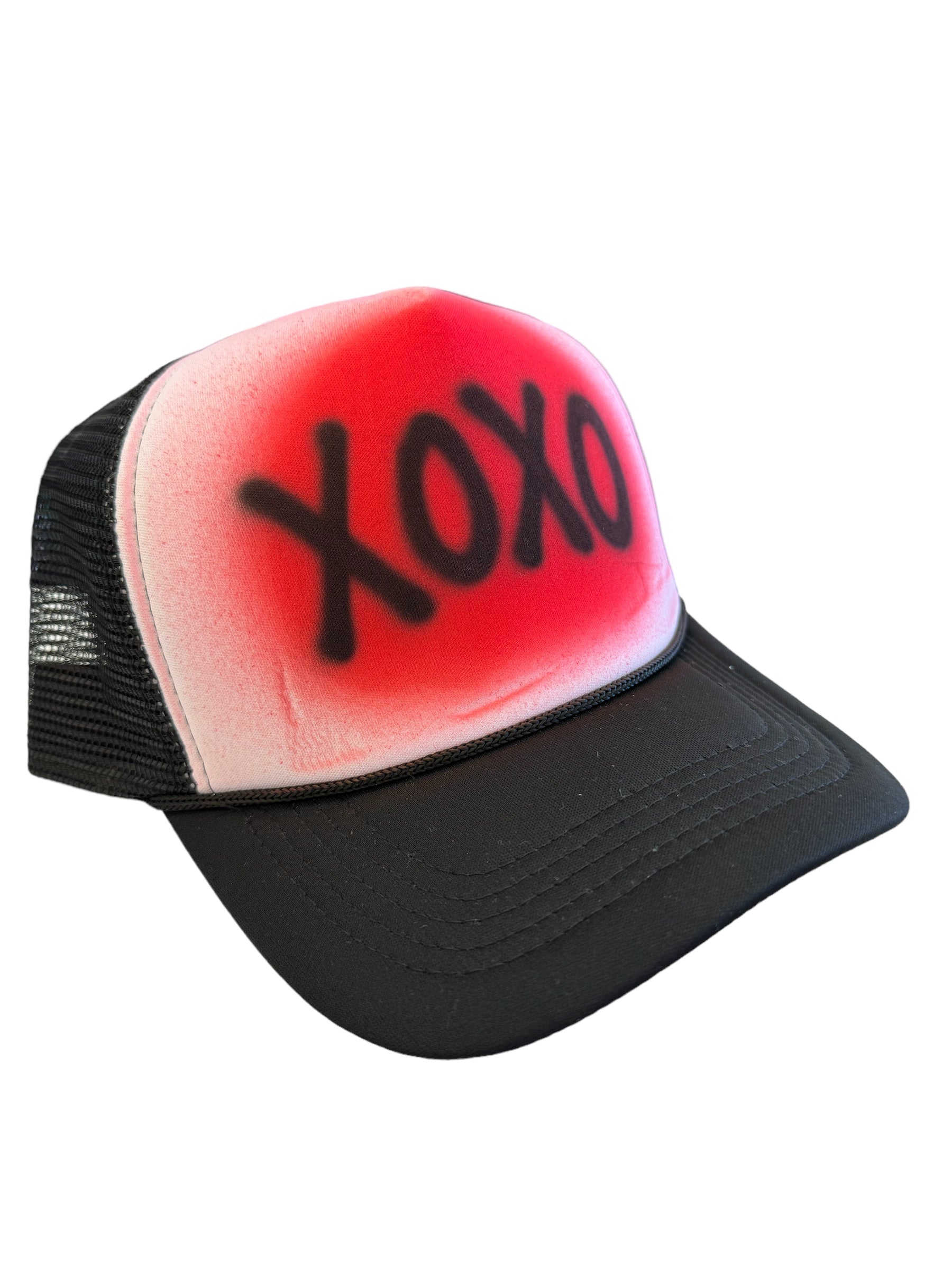 Black trucker hat with white front panel and bold red XOXO Valentine design