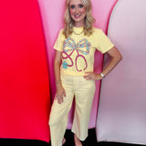 Butter yellow Comfort Colors tee with floral bow stethoscope graphic and colorful accents