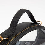 black football-shaped crossbody bag top handle, gold hardware. 