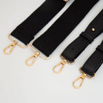 Black clear football-shaped crossbody bag with black trim adjustable strap 